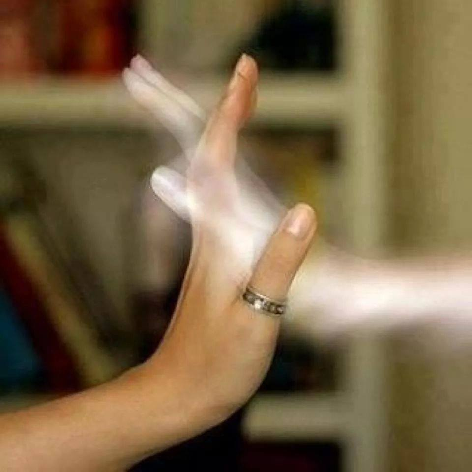 Ghostly hand holding a living hand.