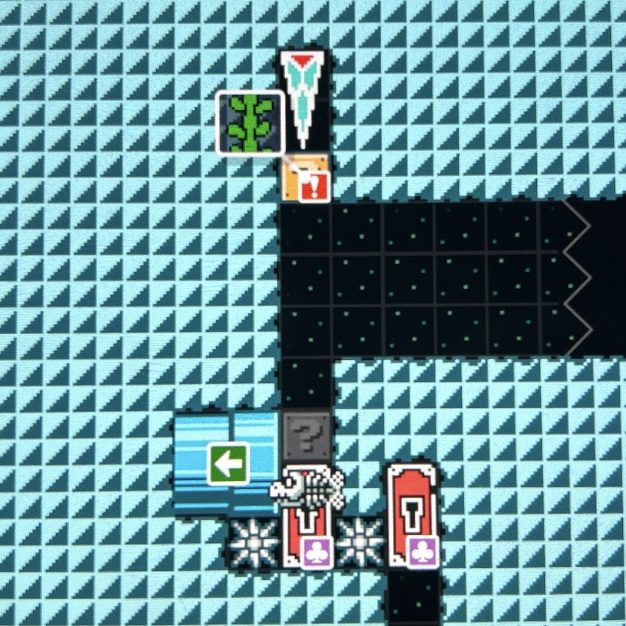 A Super Mario Bros 3 level with a 3 wide by 11 tall section of blocks.

The blocks are as follows, left to right, bottom to top:

ground, ground, ground;
spike trap, key door, spike trap;
pipe, fish bone, ground;
pipe, hidden block, ground;
ground, air, ground;
ground, air, air;
ground, air, air;
ground, air, air;
ground, vine block, ground;
ground, icicle, ground;
ground, icicle, ground.