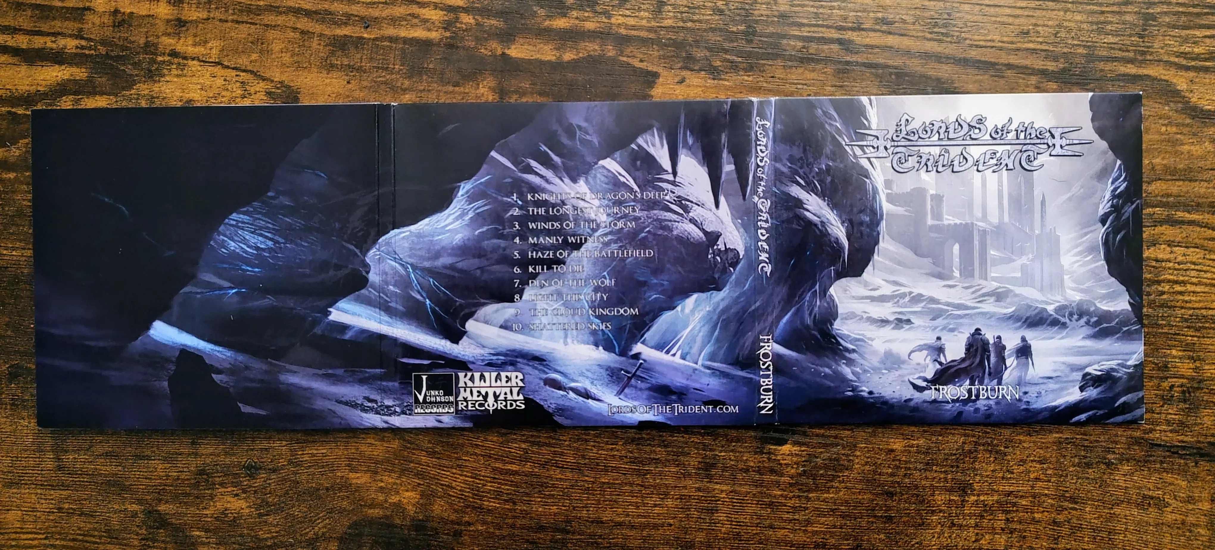 Lords of the Trident "Frostburn" CD cover with a lovely full wrap scene of an ice cavern and castle