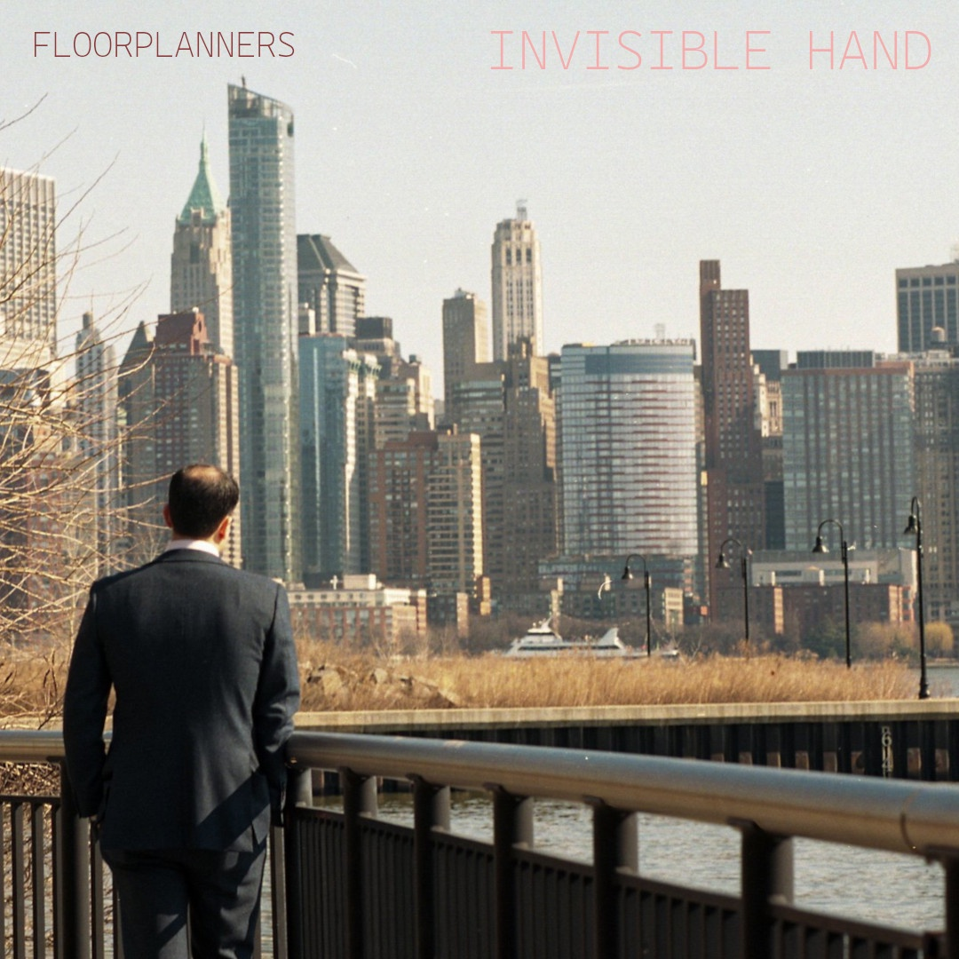 A fake album cover for 'Invisible Hand' by Floorplanners, featuring a man in a suit facing away from the camera, standing at a railing and looking across a body of water at a city skyline