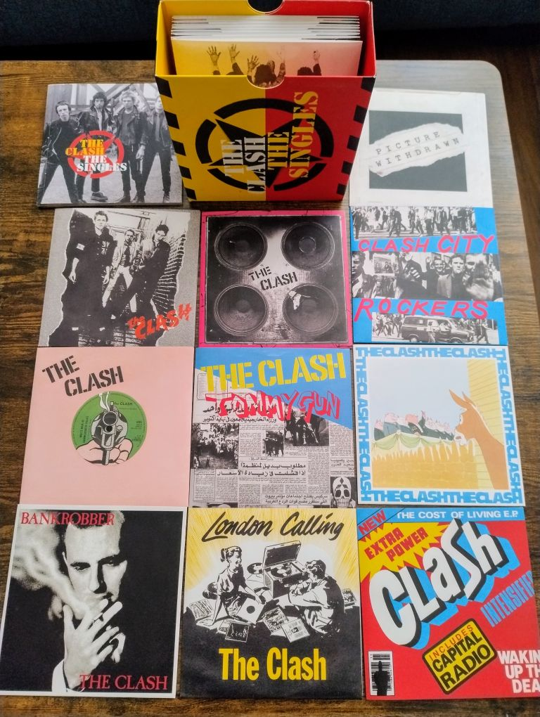 The Clash "The Singles" boxed set with a number of the discs spread, showing how each one is packaged like the original 45