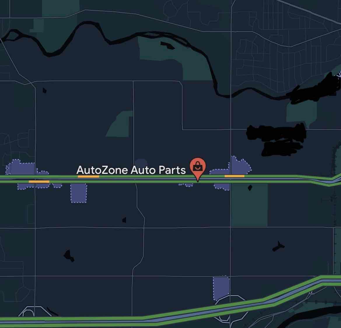 A map depicting an icon for Auto Zone on a straight section of road with no cross streets or curves.