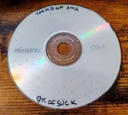 CD-R titled "700mb of rock, 0k of suck"